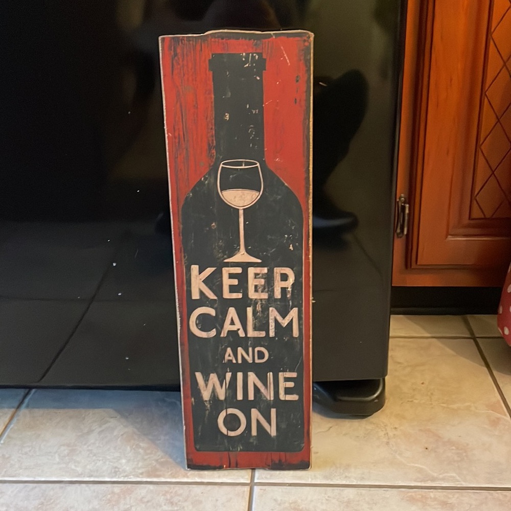 Wooden “keep calm and wine on” sign